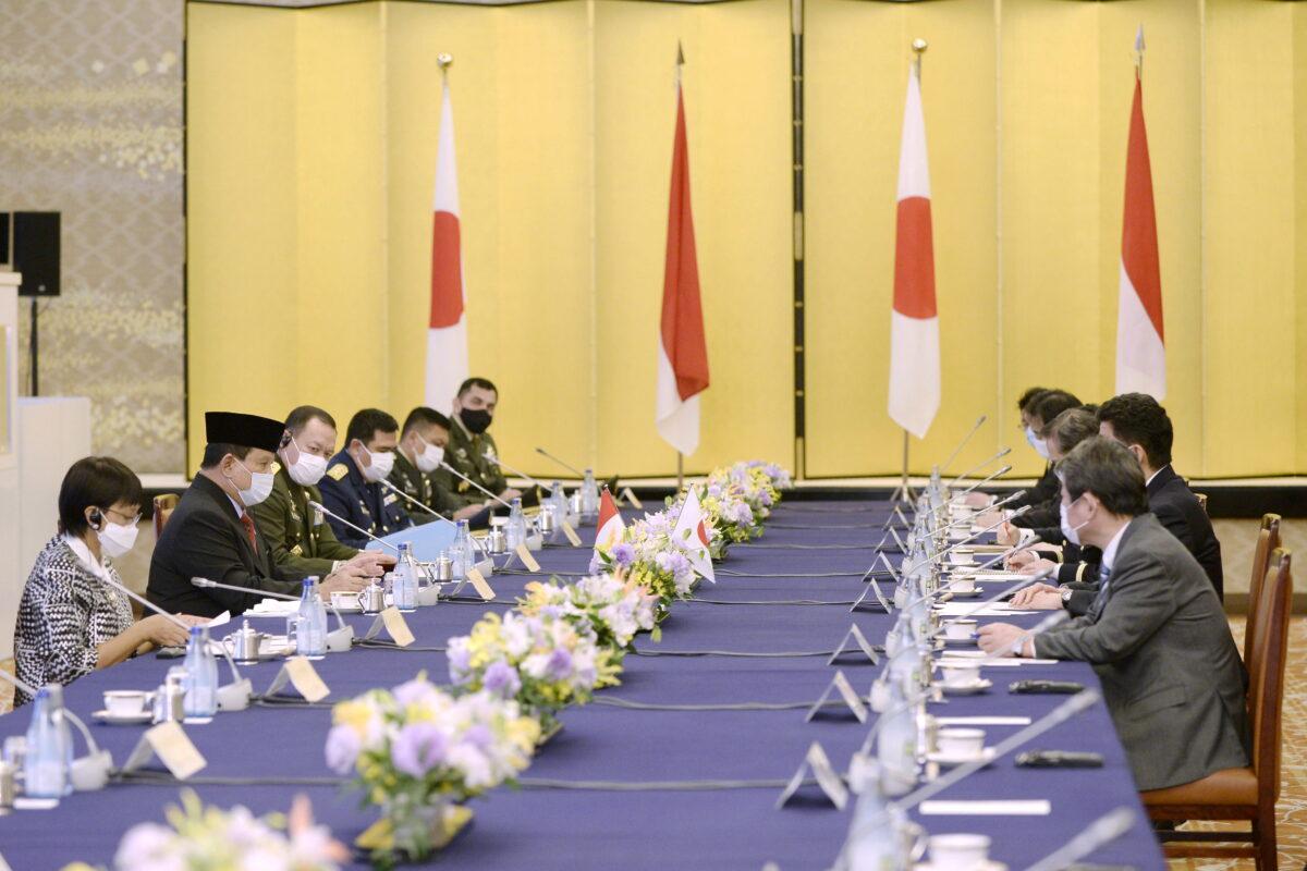 Indonesian Foreign Minister Retno Marsudi and Defense Minister Prabowo Subianto speak with Japanese Foreign Minister Toshimitsu Motegi and Defense Minister Kishi Nobuo during the "two-plus-two" meeting between Japan and Indonesia at the Iikura Guest House of the Foreign Ministry in Tokyo, Japan, on March 30, 2021. (David Mareuil/Pool via Reuters)