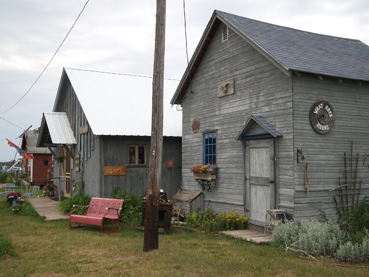 Old harbor buildings now house little shops along the lakeside in Cornucopia, Wis. (Kevin Revolinski)