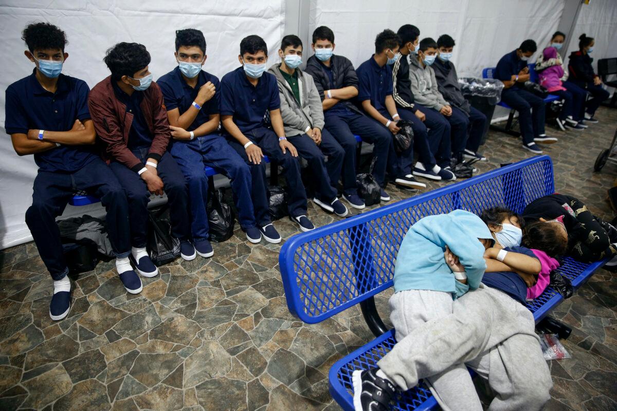 Unaccompanied minors wait for their turn at the secondary processing station inside a holding facility in Donna, Texas, on March 30, 2021. (Dario Lopez-Mills/Pool/AP Photo)