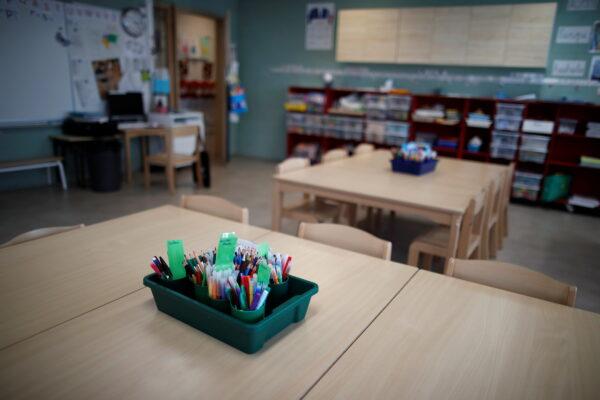 Tables and chairs are seen in a closed classroom at the private primary school Jeanne D'Arc in Saint-Maur-des-Fosses, near Paris, amid the CCP virus outbreak in France, on March 30, 2021. (Gonzalo Fuentes/Reuters)