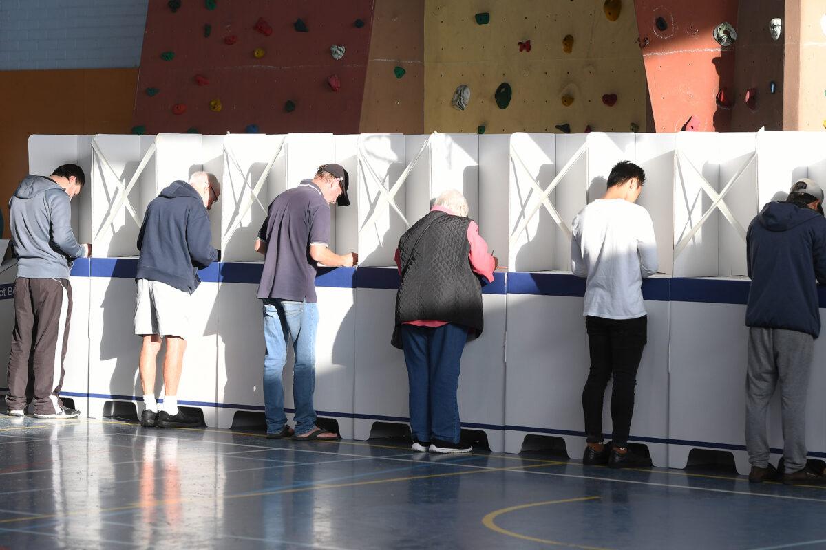 Tasmanians fill out their ballot forms in Hobart, Australia, on May 1, 2021. (Steve Bell/Getty Images)
