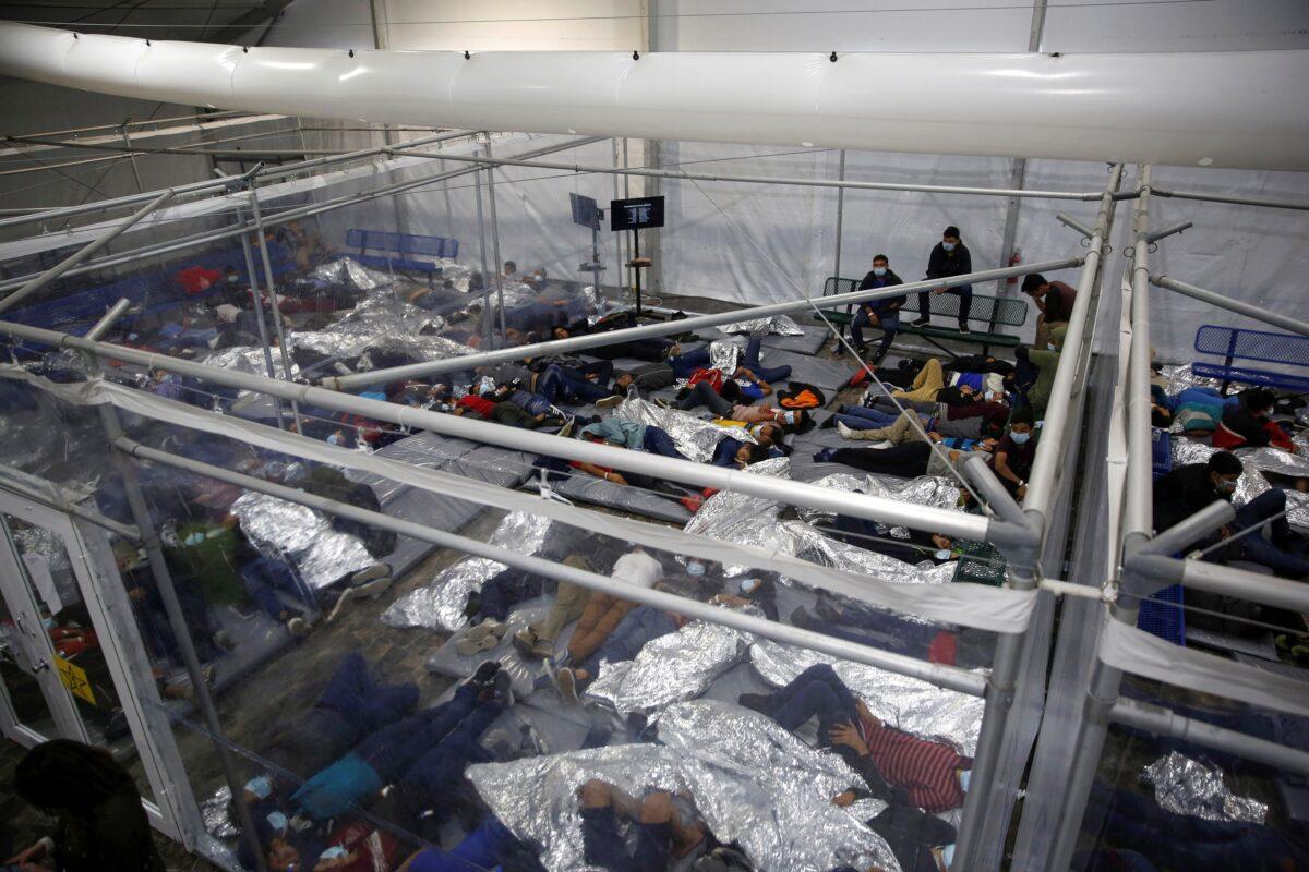 Immigrant children rest inside a pod in a Department of Homeland Security holding facility in Donna, Texas, on March 30, 2021. (Dario Lopez-Mills/Pool via Reuters)