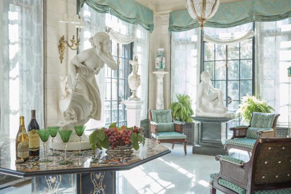 Early 20th-century Italian sculptures sit in the loggia that overlooks Forsyth Park across the street. (Thomas Loof Photography)