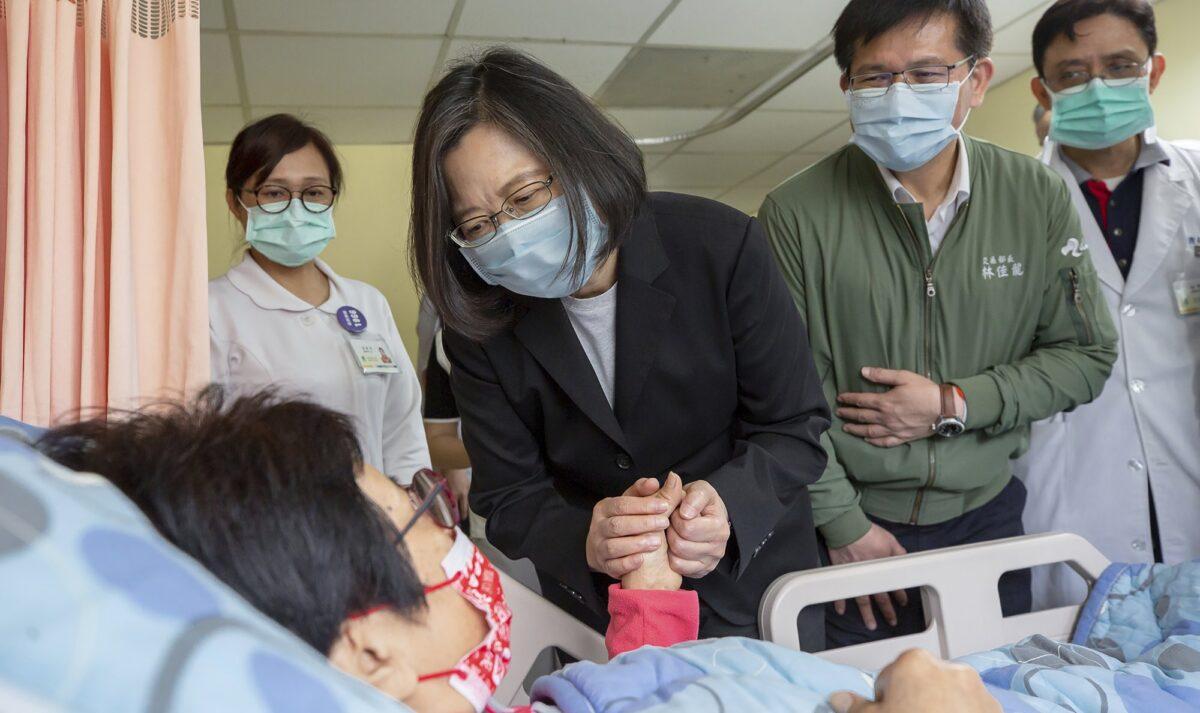 In this photo released by the Taiwan Presidential Office, Taiwan President Tsai Ing-wen visits those injured in the train derailment at a hospital in Hualien, eastern Taiwan on April 3, 2021. (Taiwan Presidential Office via AP)