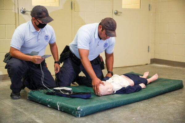 Border Patrol Processing Coordinator trainees during a first aid scenario at the Border Patrol training facility in Artesia, New Mexico, on April 1, 2021. (Charlotte Cuthbertson/The Epoch Times)