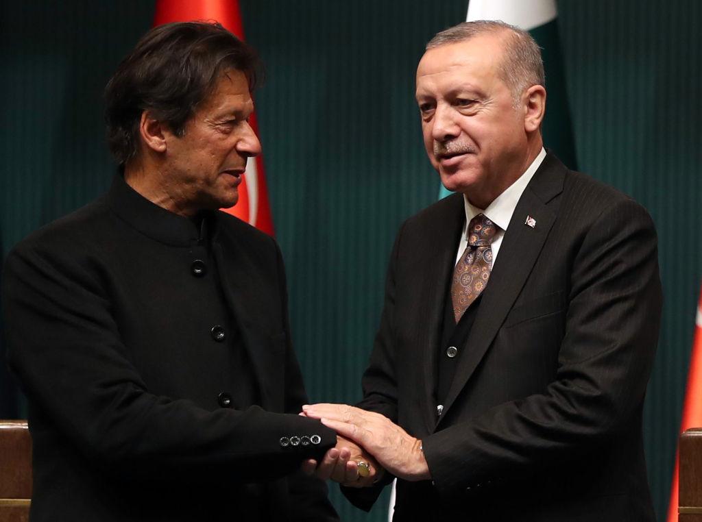Turkish President Recep Tayyip Erdogan (R) and Pakistani Prime Minister Imran Khan (L) shake hands after a joint press conference at the presidential complex in Ankara, Turkey, on Jan. 4, 2019. (ADEM ALTAN/AFP via Getty Images)