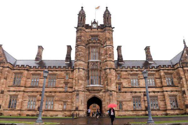 Students walk from the quadrangle at the University of Sydney, in Sydney, on Sept. 22, 2016. (AAP Image/Paul Miller)
