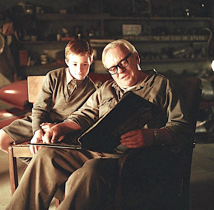 Tom (Aaron Murphy, L) and Burt Munro (Anthony Hopkins) have a bedtime story, in “The World’s Fastest Indian.” (Magnolia Pictures)