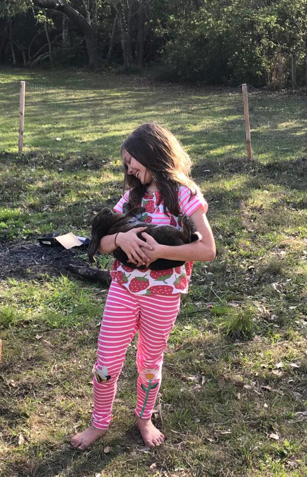 The author's little sister, Giovanna, with her rabbit Fatty Bolger. (Courtesy of John Falce)