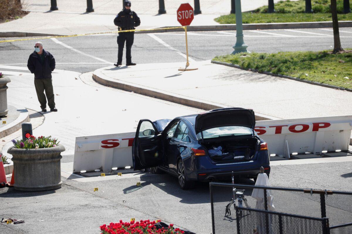 A blue car is seen after ramming a police barricade outside the U.S. Capitol building, in Washington on April 2, 2021. (Tom Brenner/Reuters)