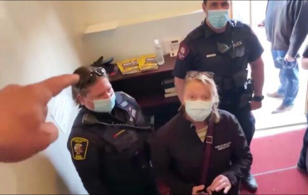 Pastor Artur Pawlowski drives police and public health officials on a COVID-19 check out of the Fortress (Cave) of Adullam church in Calgary, Canada, on Holy Saturday, April 3, 2021. (Screenshot Youtube via The Epoch Times)