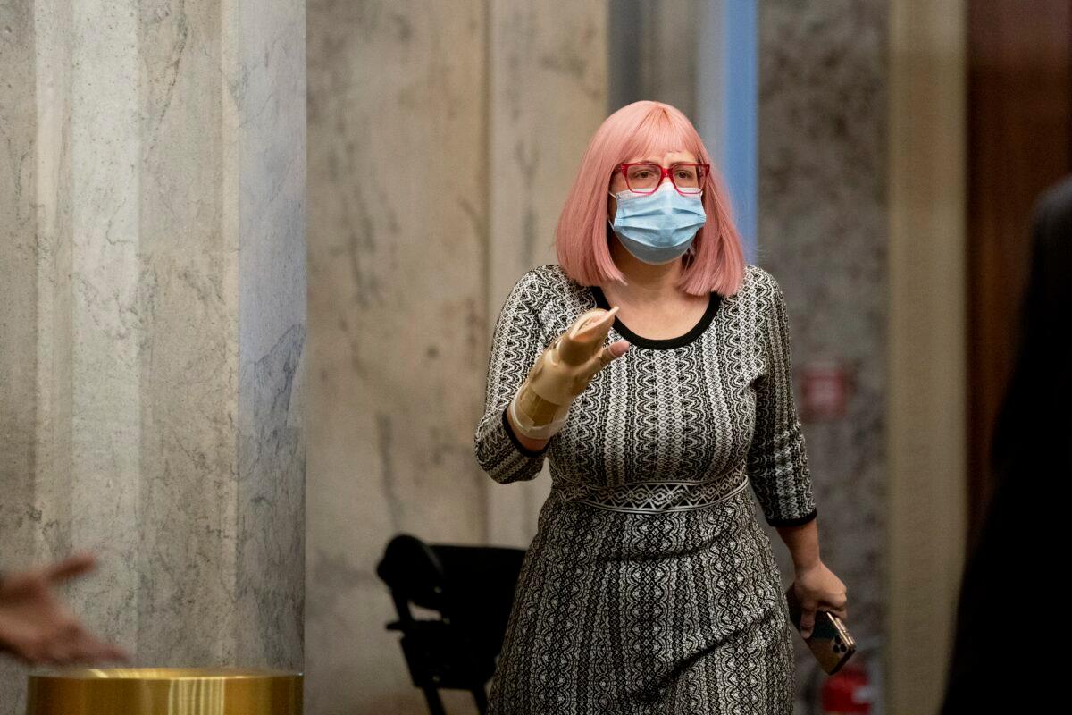 Sen. Kyrsten Sinema (D-Ariz. walks on Capitol Hill in Washington on Dec. 11, 2020. (Stefani Reynolds/Getty Images)