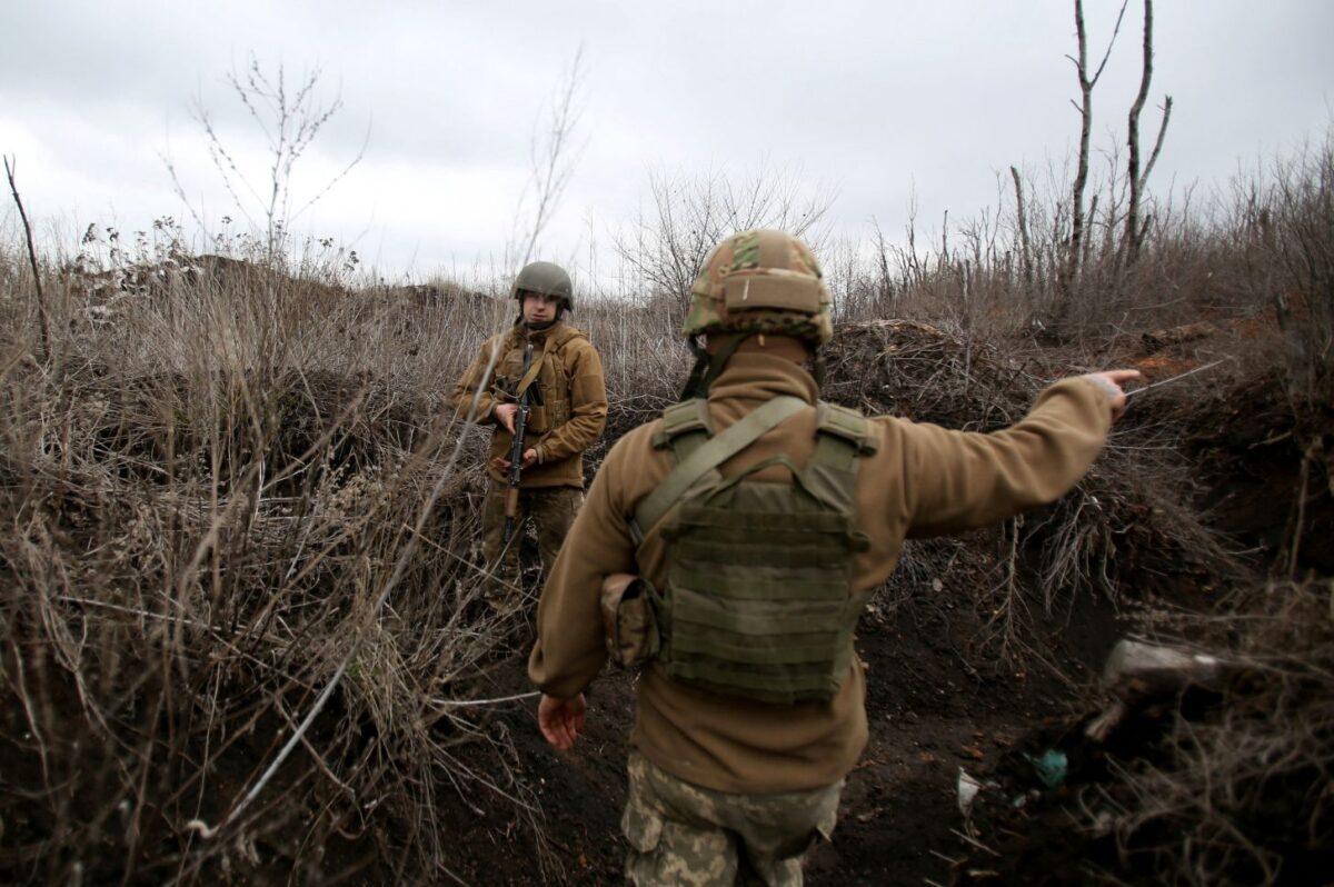 Ukrainian servicemen patrol along a position at the front line with Russia-backed separatists not far from Avdiivka, Donetsk region, on April 5, 2021. (STR/AFP via Getty Images)