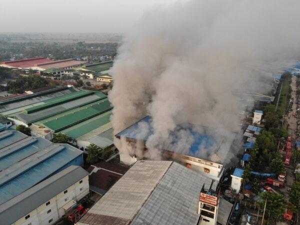 General view of a fire at JOC Galaxy (Myanmar) Apparel Co. in Hlaing Thar Yar township, Yangon, Burma, on April 7, 2021. (Fire Services Department/Handout via Reuters)