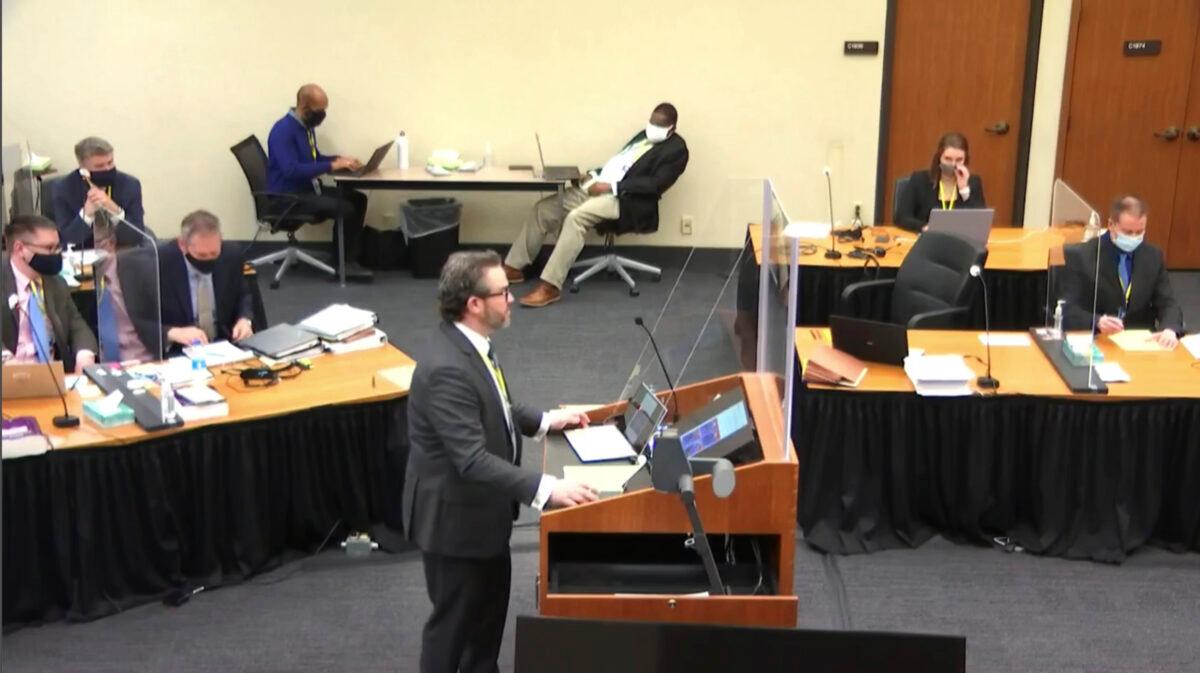 In this image taken from video, defense attorney Eric Nelson questions witness Los Angeles police department Sergeant Jody Stiger, as Hennepin County Judge Peter Cahill presides in the trial of former Minneapolis police Officer Derek Chauvin at the Hennepin County Courthouse in Minneapolis, Minn., on April 7, 2021. (Court TV via AP/Pool)