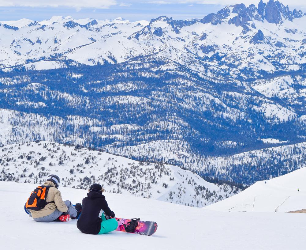 Snowboarders take in the view. (Gloria V Moeller/Shutterstock)