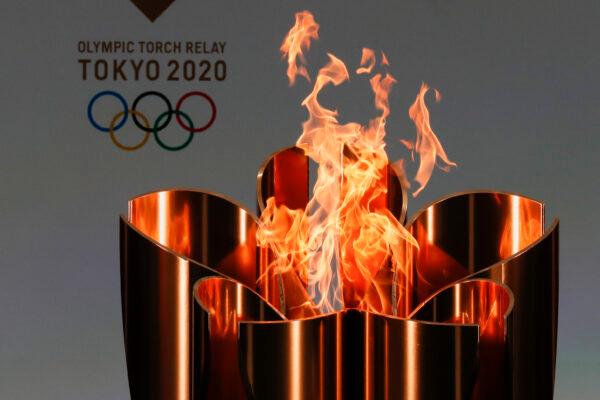 The celebration cauldron is seen lit on the first day of the Tokyo 2020 Olympic torch relay in Naraha, Fukushima prefecture, northeastern Japan, on March 25, 2021. (Kim Kyung-Hoon/Pool Photo via AP)