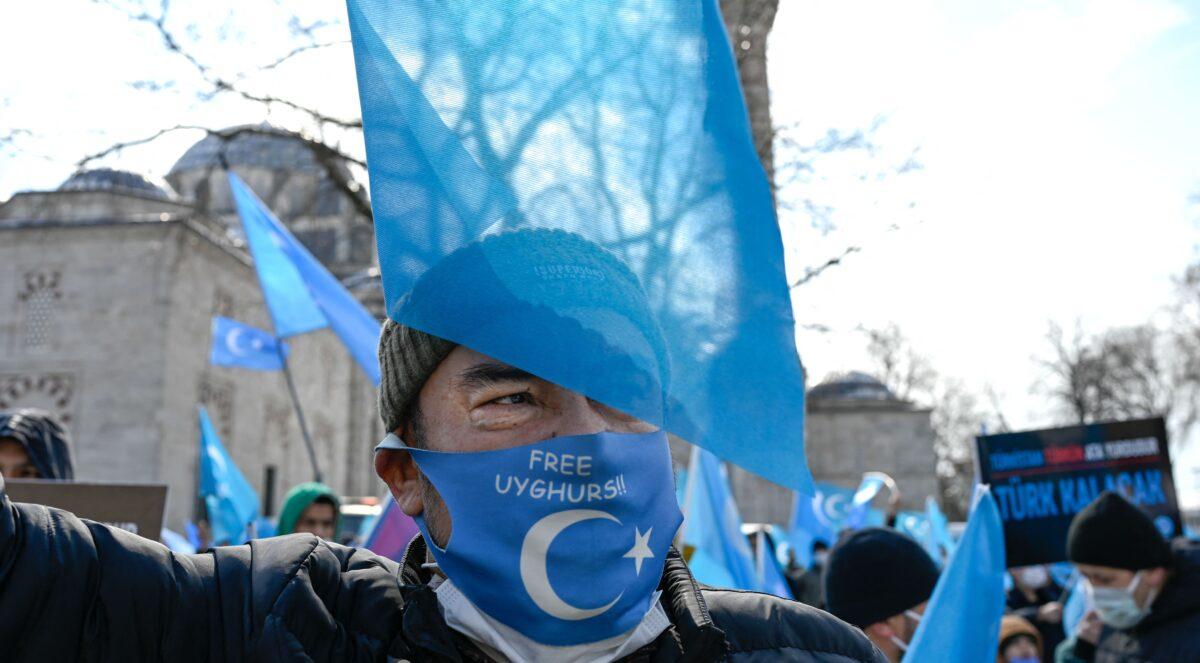 A protester from the Uyghur community living in Turkey attends a protest against the visit of China's Foreign Minister to Turkey, in Istanbul, Turkey, on March 25, 2021. (Bulent Kilic/AFP via Getty Images)