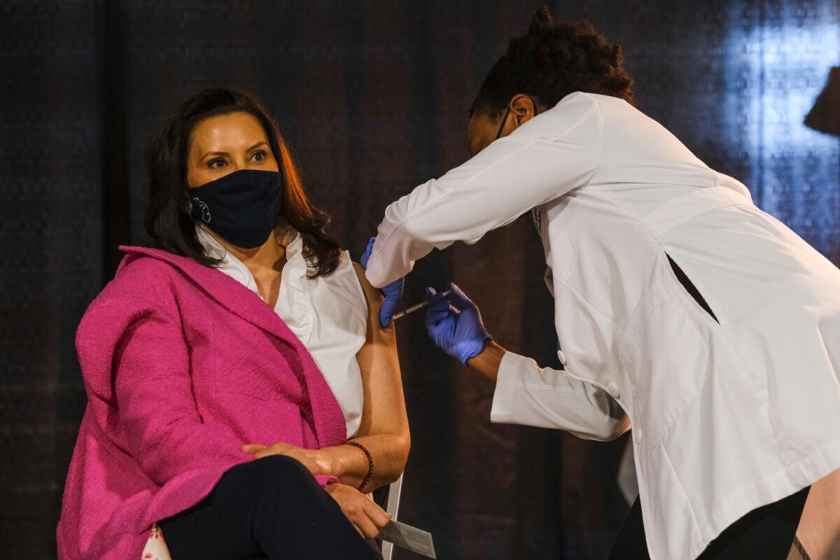 Michigan Gov. Gretchen Whitmer receives a dose of the Pfizer COVID-19 vaccine at Ford Field during an event to promote and encourage Michigan residents to get the vaccine, in Detroit, Mich., on April 6, 2021. (Matthew Hatcher/Getty Images)