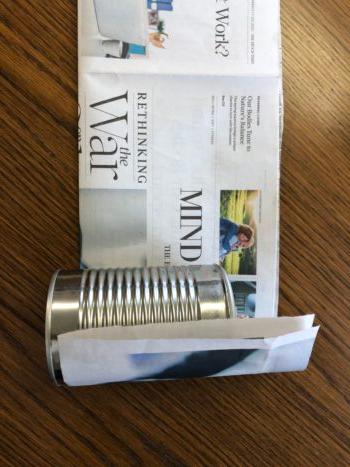 Prepare your folded newspaper strip and set your can at the bottom. (Matt Fowler)