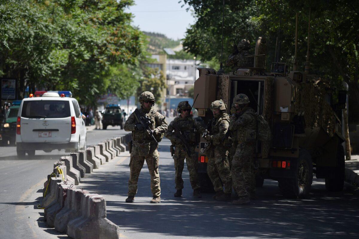 U.S. soldiers stand guard near the site of a car bomb in the Afghan capital Kabul on May 31, 2017. (AWAKIL KOHSAR/AFP via Getty Images)