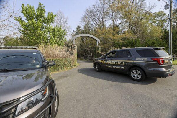 A York County sheriff vehicle on April 8, 2021, drives onto a property where multiple people, including a prominent doctor, were fatally shot a day earlier in Rock Hill, S.C. (Nell Redmond/AP Photo)