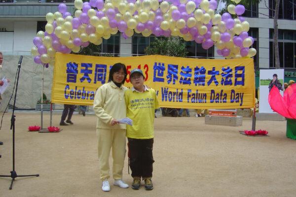 Wang Ying and her son join the celebration of World Falun Dafa Day after they fled to Australia. (Courtesy of Wang Ying)