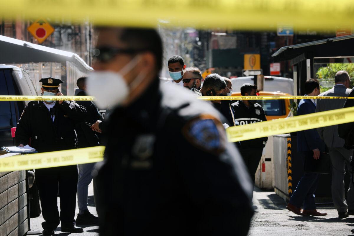 Police gather at the scene of an afternoon shooting along Ludlow Street in the lower Manhattan neighborhood of New York City, amid a continued rise in shootings in the city, on March 30, 2021. (Spencer Platt/Getty Images)