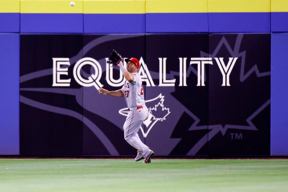 Mike Trout of the Los Angeles Angels catches a fly ball during the seventh inning against the Toronto Blue Jays during the season home opener at TD Ballpark in Dunedin, Florida, on April 08, 2021. Douglas P. DeFelice/Getty Images)
