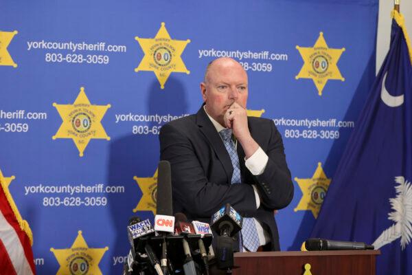 York County Sheriff Kevin Tolson listens as a 911 call is played during a press conference in York, S.C. where he addressed the mass shooting by former NFL football player Phillip Adams, S.C., on April 8, 2021. (Nell Redmond/AP Photo)