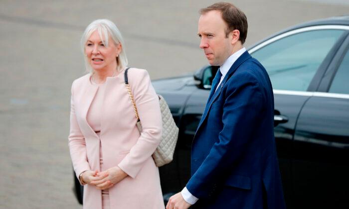 Mental health minister Nadine Dorries (L), and Health Secretary Matt Hancock visit the ExCeL London exhibition centre, which has been transformed into the "NHS Nightingale" field hospital, in London on April 3, 2020. (Tolga Akmen/AFP via Getty Images)