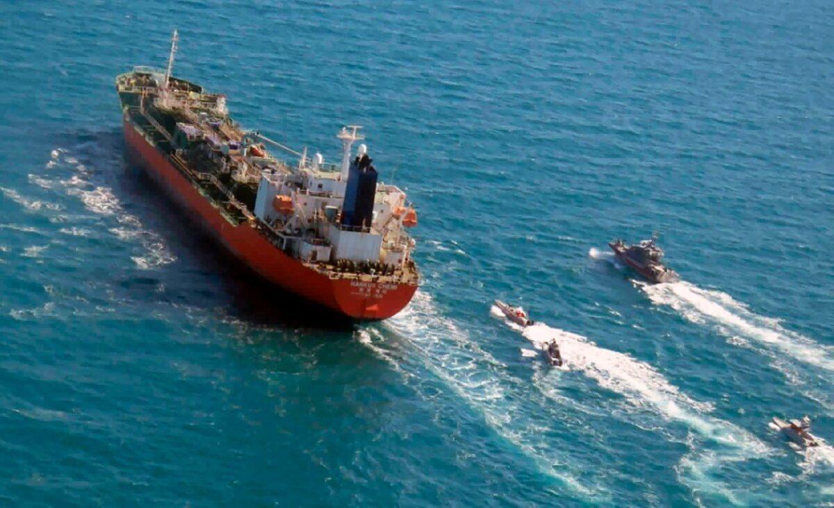 A seized South Korean-flagged tanker is escorted by Iranian Revolutionary Guard boats on the Persian Gulf, on Jan. 4, 2021. (Tasnim News Agency via AP/File)