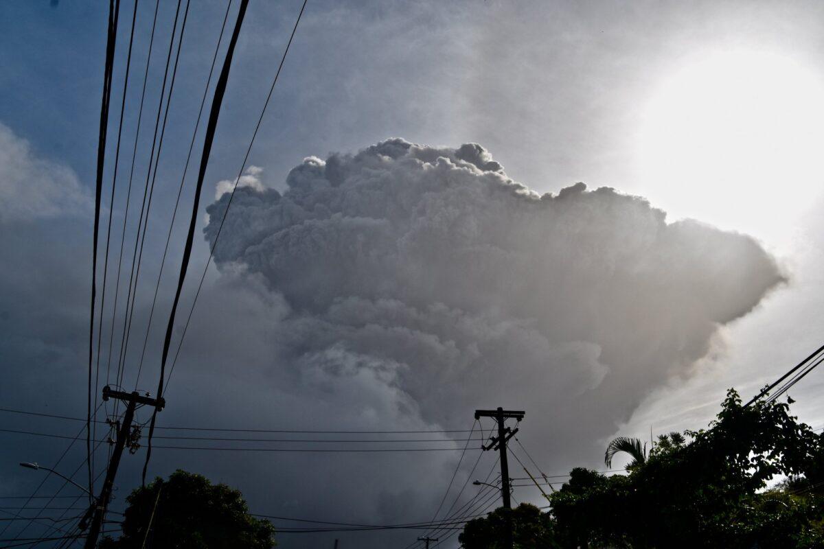 Ash rises into the air as La Soufriere volcano erupts on the eastern Caribbean island of St. Vincent, seen from Chateaubelair on April 9, 2021. (Orvil Samuel/AP Photo)