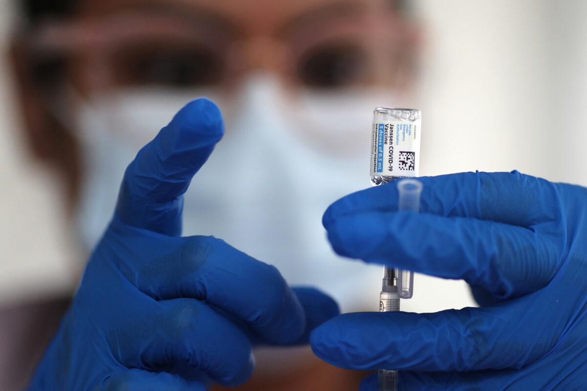 A nurse draws from a vial of the Johnson & Johnson COVID-19 vaccine, in Los Angeles, on March 25, 2021. (Lucy Nicholson/Reuters)