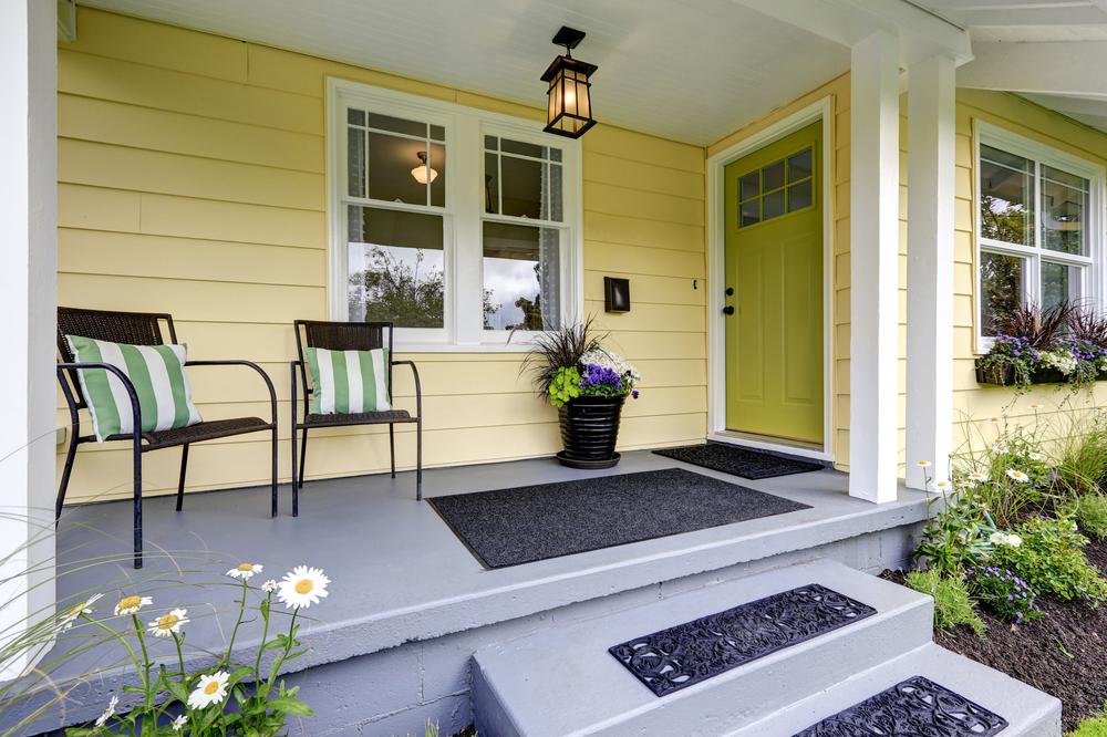 Covered porches, decks, and patios can help connect your home to the landscape and outside living spaces. (Artazum/Shutterstock)