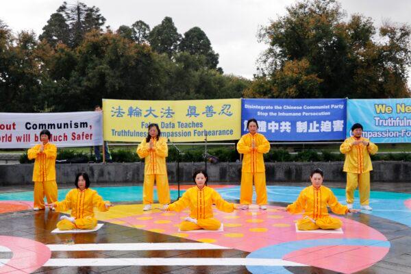 People demonstrate the five sets of Falun Gong's qigong exercises at a rally in Bendigo, Victoria, on April 10, 2021. (The Epoch Times)