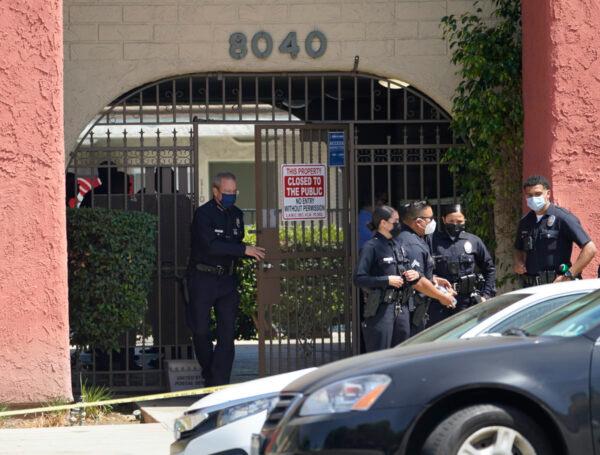 Los Angeles Police Chief Michel Moore exits an apartment complex as police investigate in Reseda, Calif., on April 10, 2021. (Damian Dovarganes/AP)