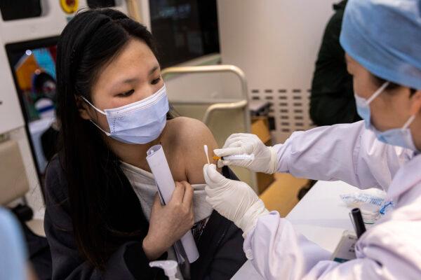 Residents receive the COVID-19 vaccine on the move vaccination vehicle during the 3rd World Health Expo held in Wuhan, Hubei Province, China, on April 8, 2021. (Getty Images)