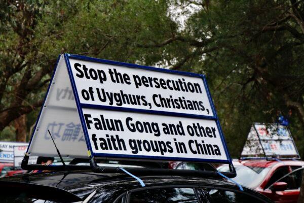 Car mounted banner that says “Stop the persecution of Uyghurs, Christians, Falun Gong and other faith groups in China,” in Bendigo, Victoria, on April 10, 2021. (The Epoch Times)