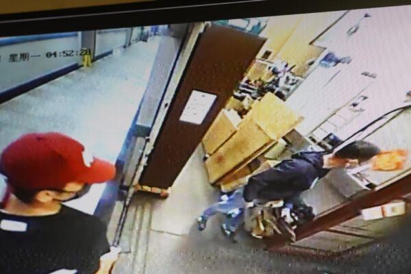 Two of the four intruders caught on CCTV. (The Epoch Times)