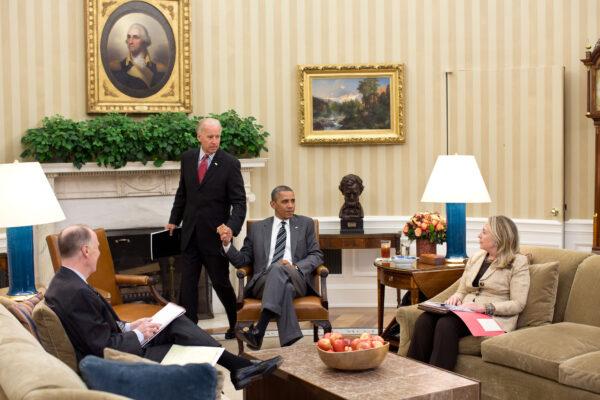 Vice President Joe Biden (Center L) arrives for a meeting with President Barack Obama, Secretary of State Hillary Rodham Clinton, and National Security Advisor Tom Donilon in the Oval Office in Washington on July 18, 2012. (Pete Souza/White House Photo via Getty Images)