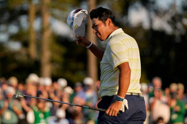 Hideki Matsuyama, of Japan, tips his cap after winning the Masters golf tournament in Augusta, Ga., on April 11, 2021. (Matt Slocum/AP Photo)