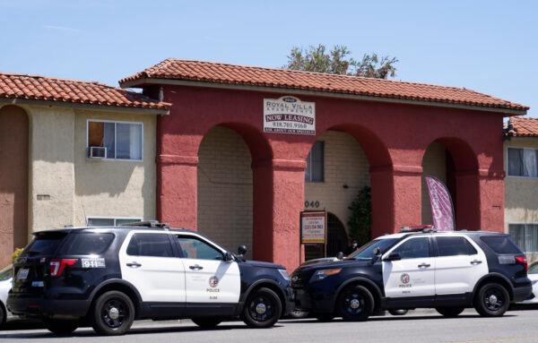 Los Angeles Police investigate the scene of a homicide where three young children were found slain at the Royal Villa apartments complex in Reseda, Calif., on April 10, 2021. (Damian Dovarganes/AP Photo)