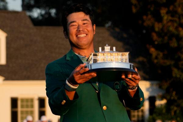 Hideki Matsuyama, of Japan, holds the trophy after winning the Masters golf tournament in Augusta, Ga., on April 11, 2021. (David J. Phillip/AP Photo)