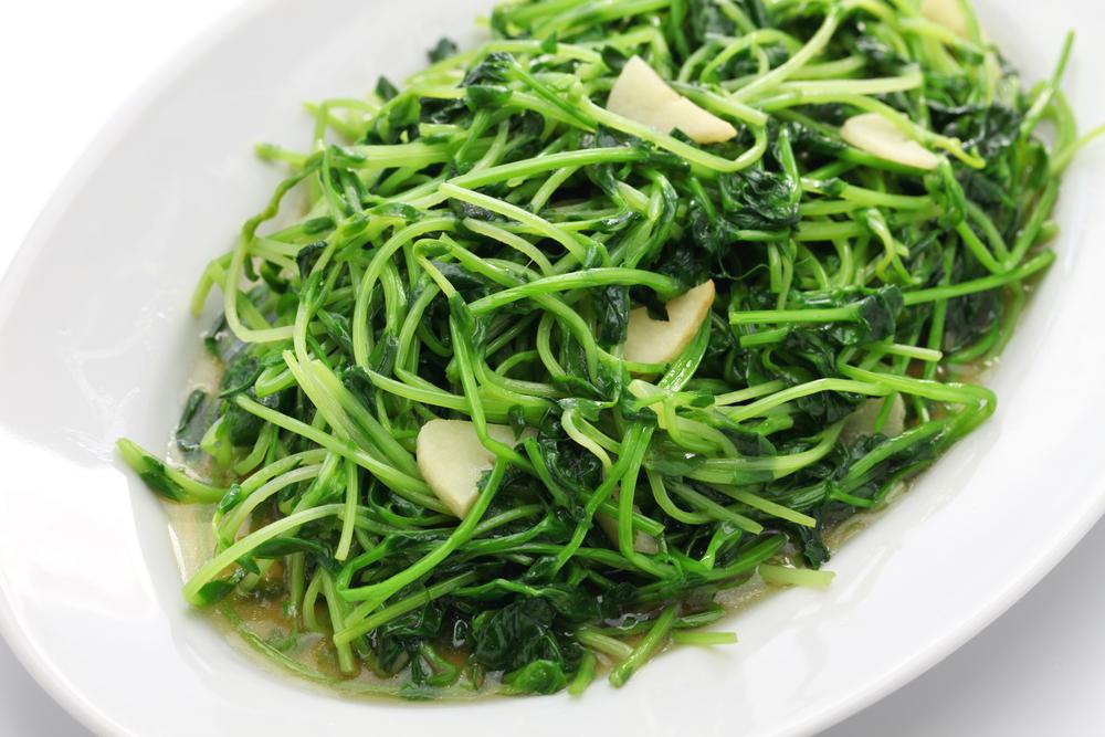 Qing chao, or "clear stir-fried" pea shoots are delicate and savory. (bonchan/Shutterstock)