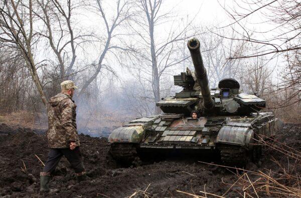 Ukrainian servicemen with their tank close to the front line of clashes with Russian-backed separatists near Lysychansk, Ukraine, on April 7, 2021. (STR/AFP via Getty Images)