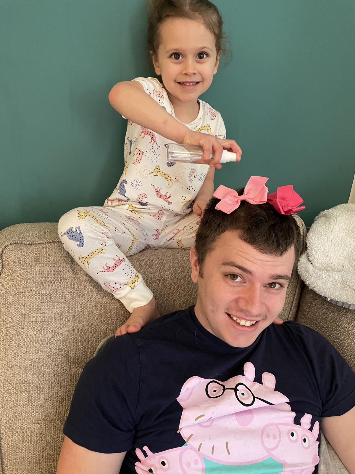 Callum Hartley getting his hair done by his daughter. (Kennedy News and Media)
