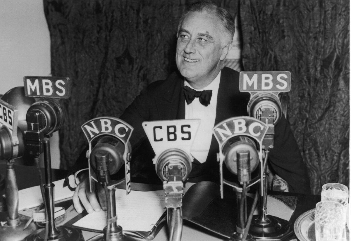 President Franklin D. Roosevelt seated in front of a number of television and radio station microphones in Washington, D.C., on Oct. 14, 1938. At least one Constitutional scholar says that Supreme Court justices appointed by Roosevelt reshaped the federal government into an administrative state by rewriting the Constitution. (Fotosearch/Getty Images)