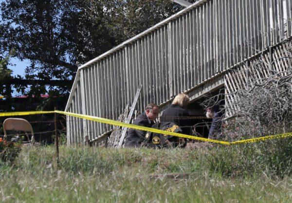 San Luis Obispo Sheriff's Office personnel dig in an area in the backyard of the home of Ruben Flores, in Arroyo Grande, Calif., on March 16, 2021. (Daniel Dreifuss/AP Photo)