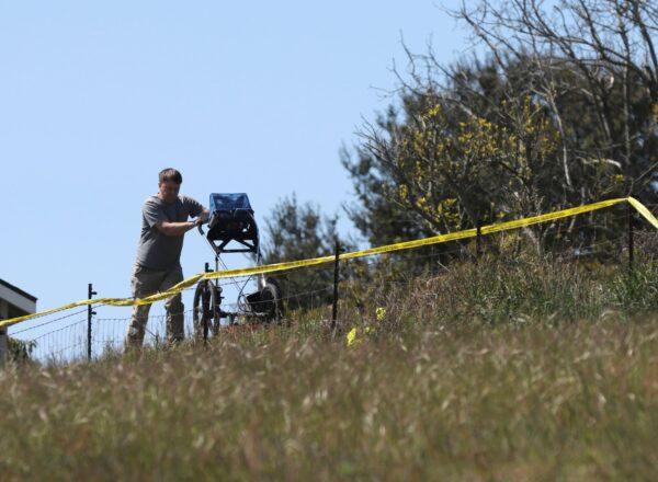 An investigator uses ground-penetrating radar to search the backyard of the home of Ruben Flores, in Arroyo Grande, Calif., on March 16, 2021. (Daniel Dreifuss/AP Photo)